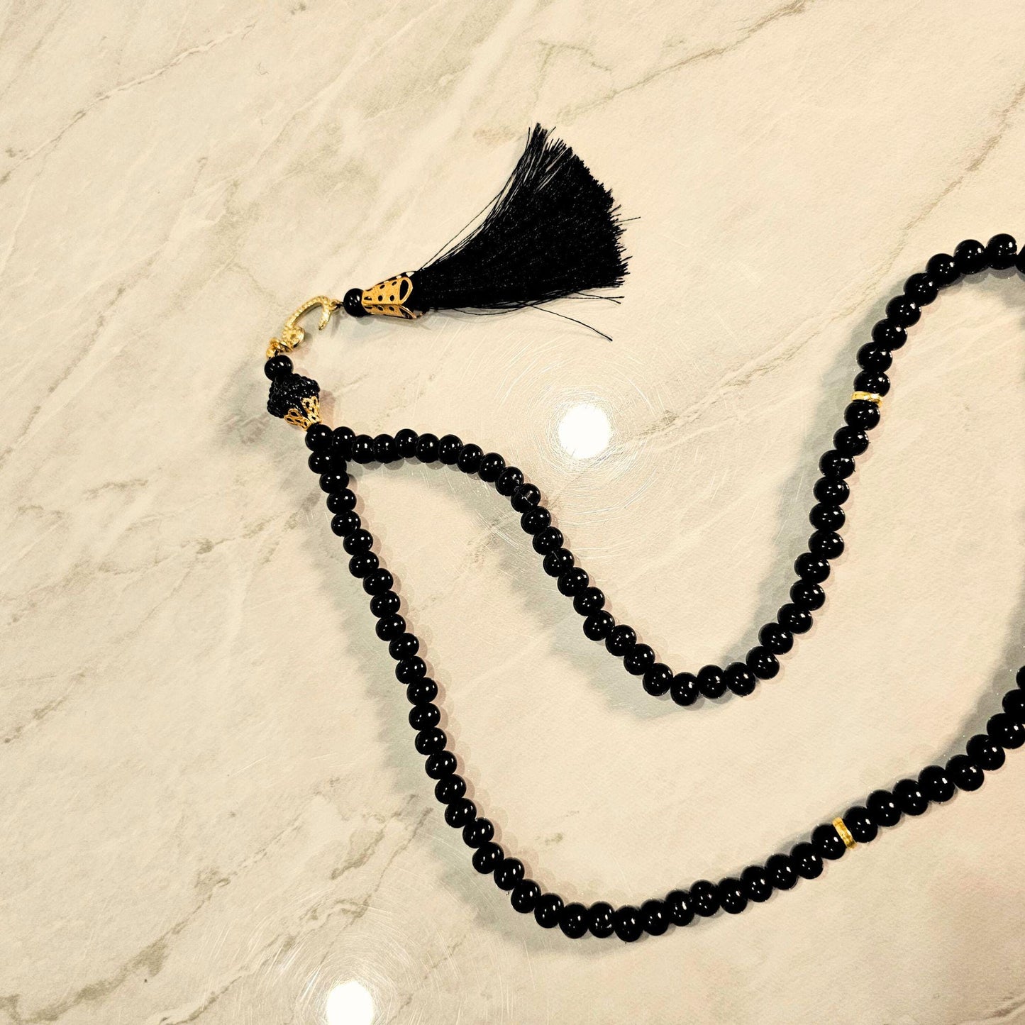 Close-up of 99-bead Tasbih set, showcasing craftsmanship and detail