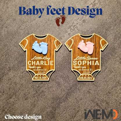 Side-by-side display of girl and boy baby magnets with crowns and feet decorations. Laser engraved walnut wood with magnet backing. Perfect personalized baby gifts or rustic keepsakes for baby showers or newborn arrival parties.