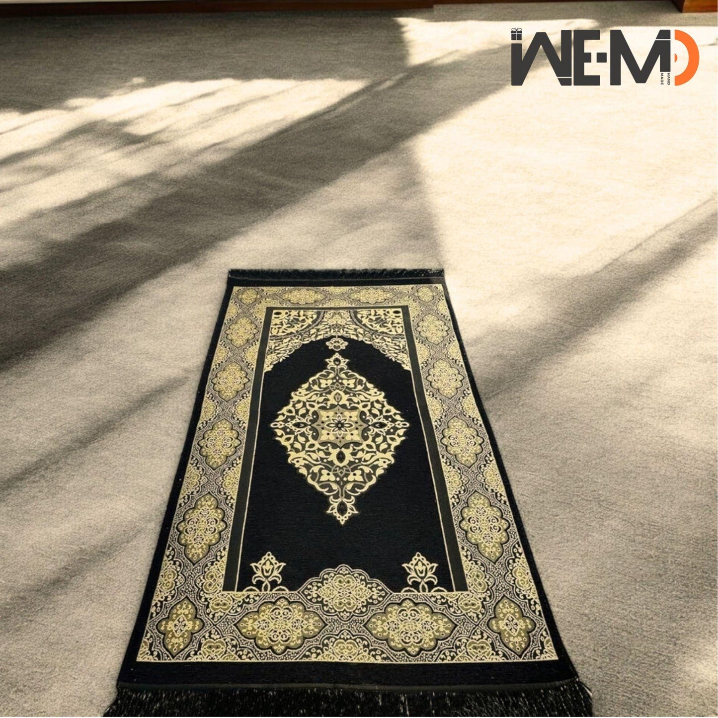 Luxurious prayer rug with intricate patterns, folded neatly beside Tasbih beads