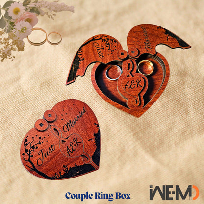 A flat lay image of a handcrafted personalized wooden heart ring box in open and closed position. Designed for couples celebrating weddings or engagements, this laser engraved box features two compartments to hold rings securely. Great for rustic wedding themes, proposal ring presentations, and anniversary gifts. A perfect engraved keepsake ring box or customized wooden gift box for newlyweds and romantic occasions.