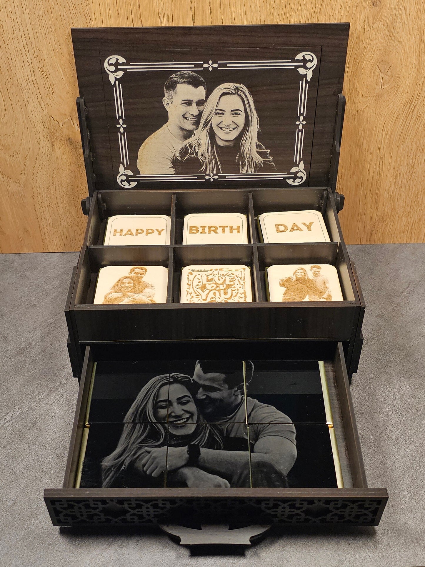 Open personalized chocolate box showing 6 engraved chocolate pieces and a custom photo mosaic in the drawer, engraved on acrylic and wood, ideal for Valentineâ€™s or anniversary gift.
