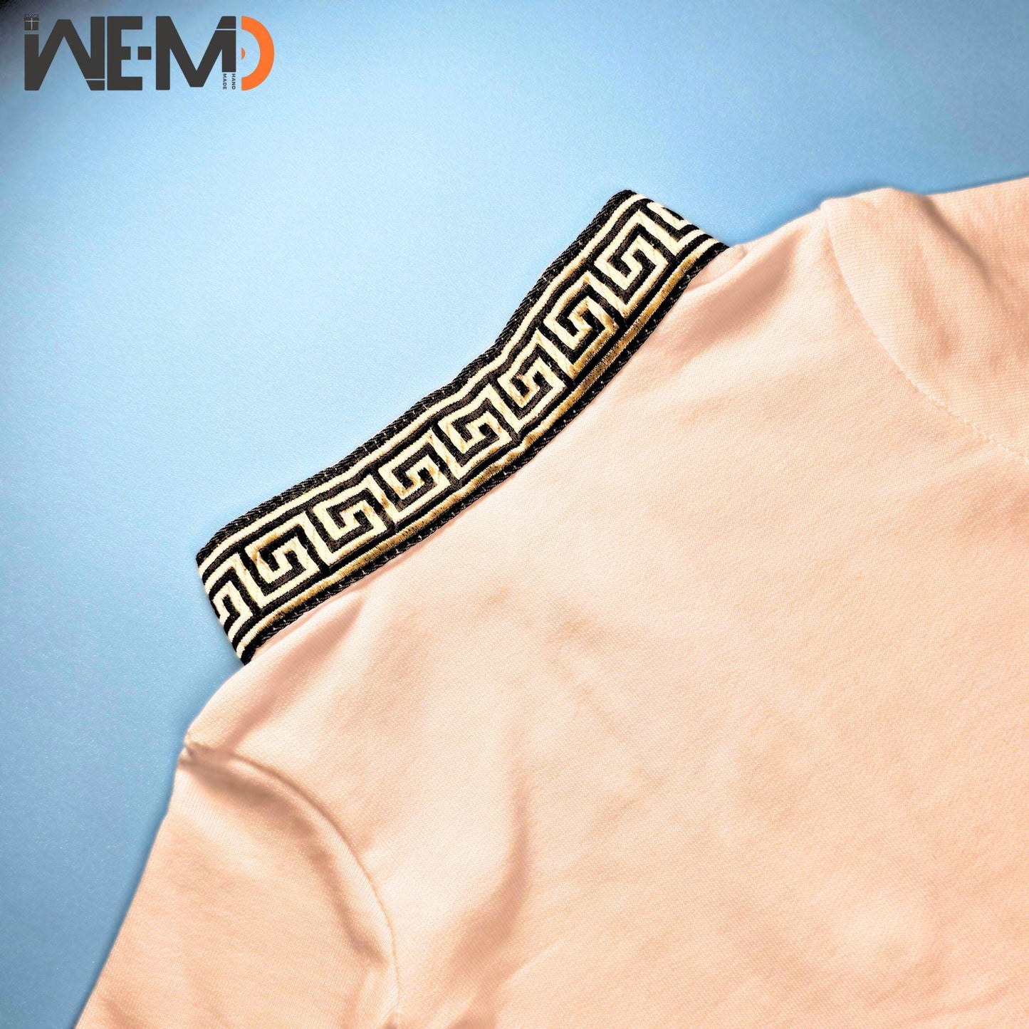 Soft baby outfit collar in Islamic embroidery, black and gold on white fabric