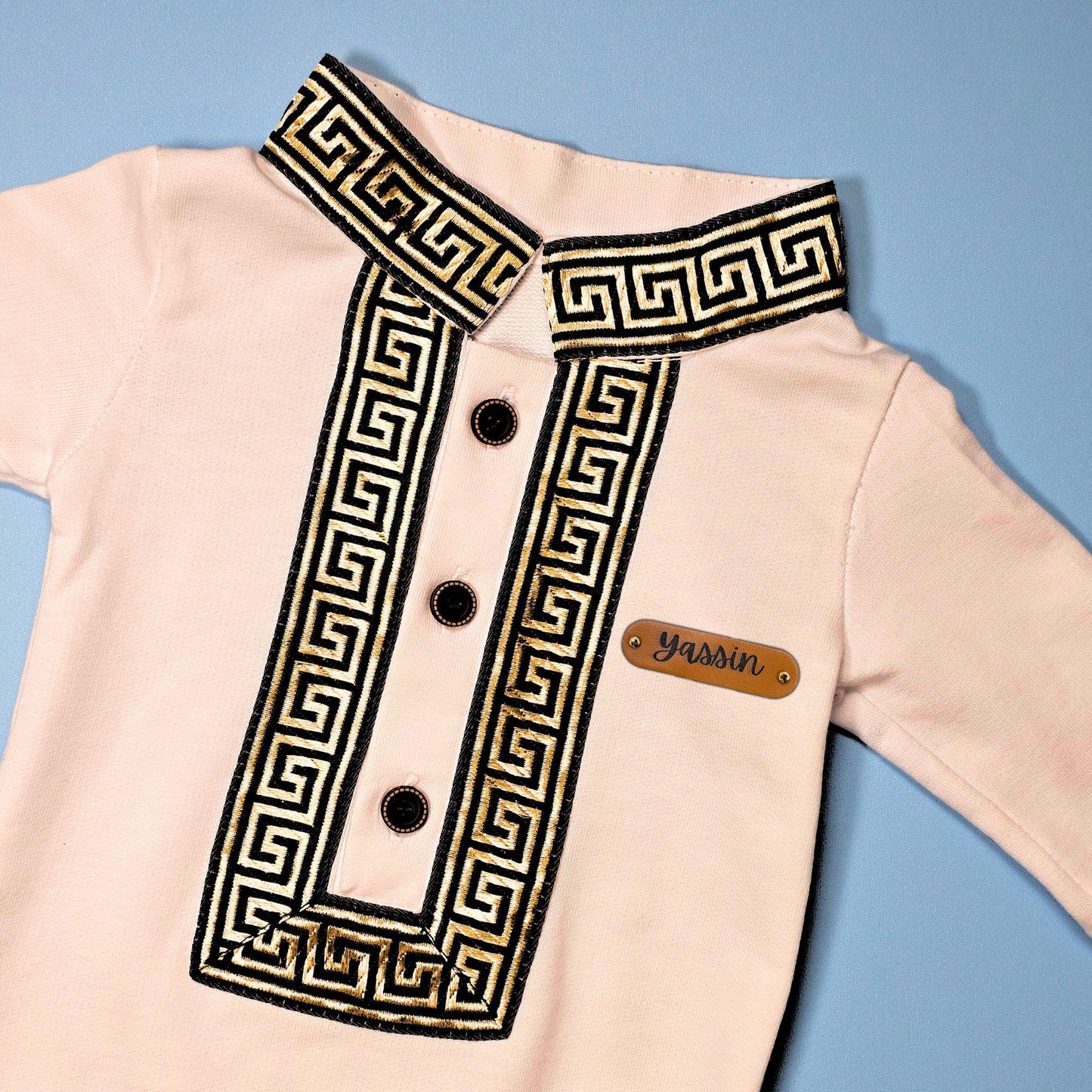 Personalized Ramadan baby jumpsuit in white with gold embroidery and name tag “Yassin”