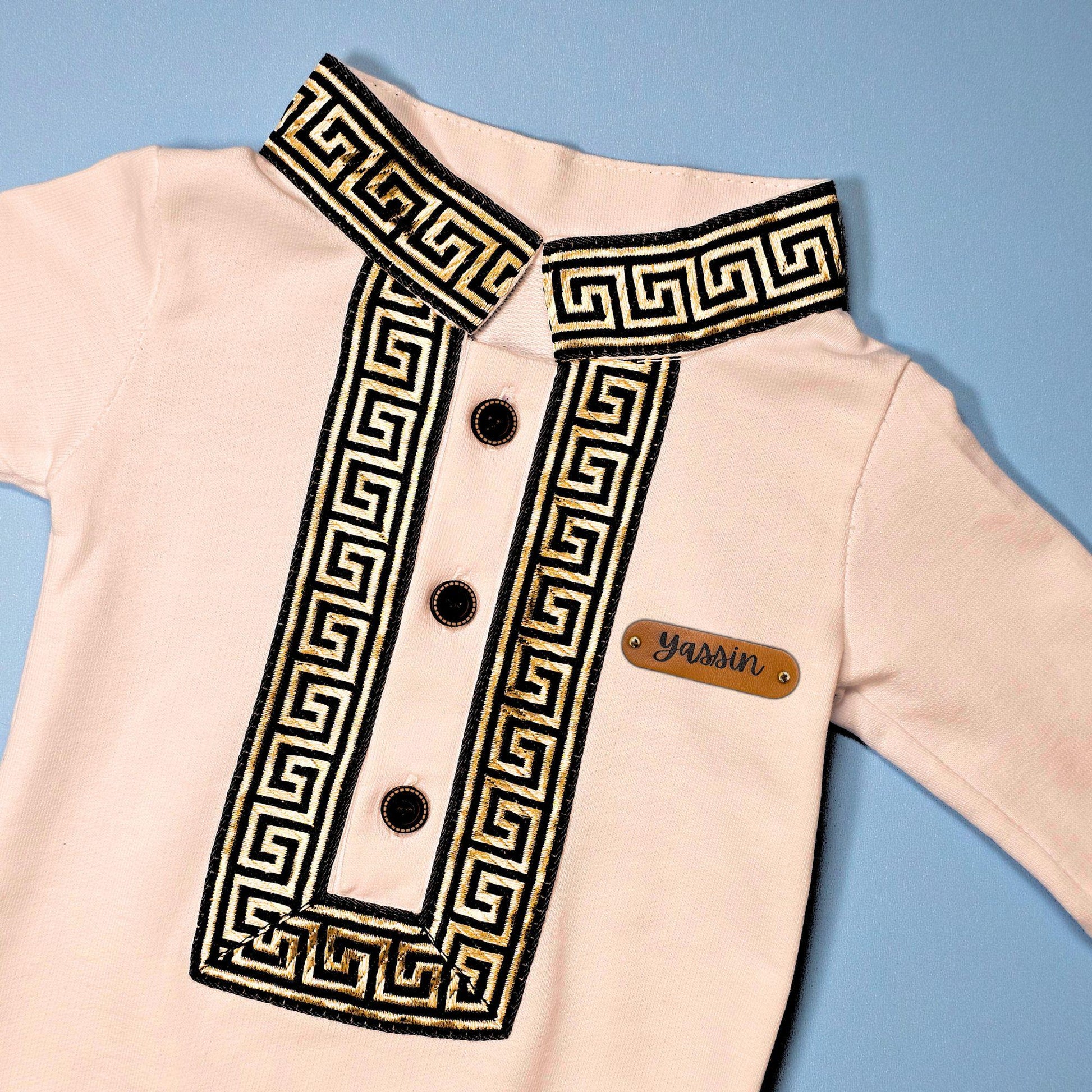 Personalized Ramadan baby jumpsuit in white with gold embroidery and name tag “Yassin”